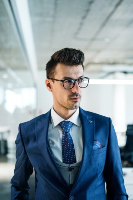 a-portrait-of-young-businessman-walking-in-an-offi-2021-08-27-16-14-46-utc.jpg