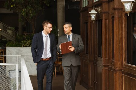 businessmen-discussion-standing-clipboard-concept-2021-08-26-23-58-00-utc.jpg